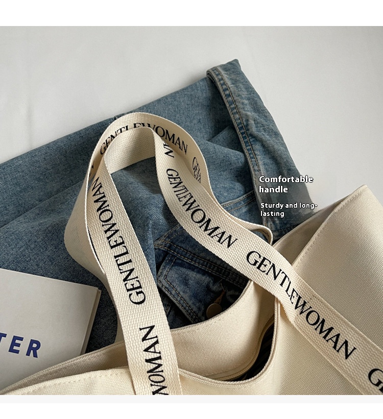 2All-over letter print with widened webbing